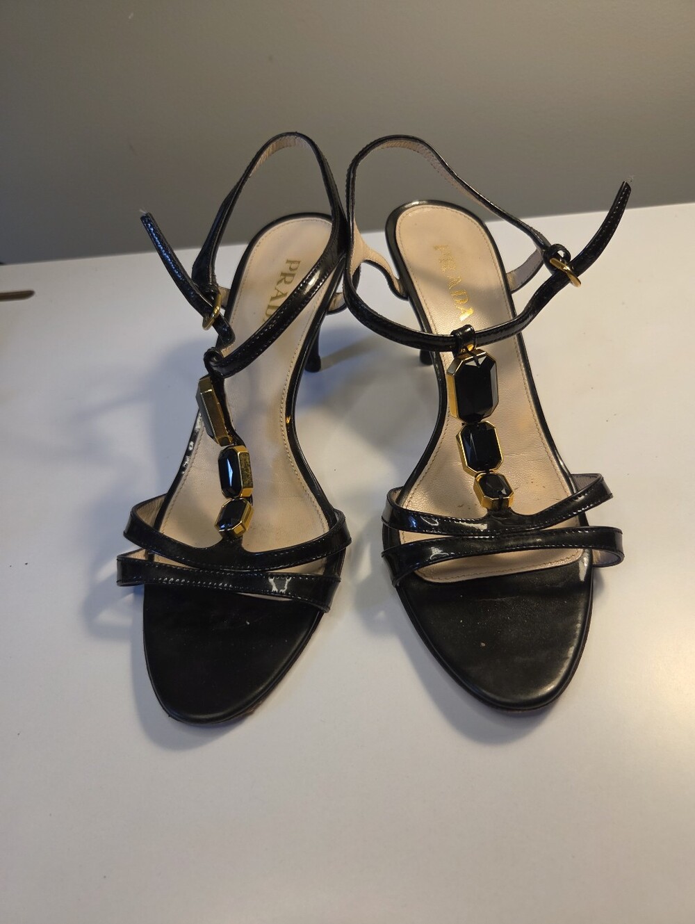 Prada Black Patent Leather Strappy Heels with Gold Accents